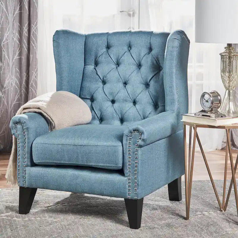 Fauteuil d'appoint moderne bleu à dossier haut capitonné avec clous décoratifs pour salon