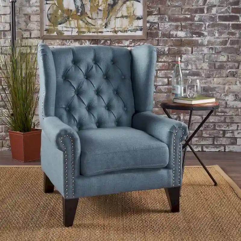 Fauteuil d'appoint moderne bleu à dossier haut capitonné avec clous décoratifs pour salon