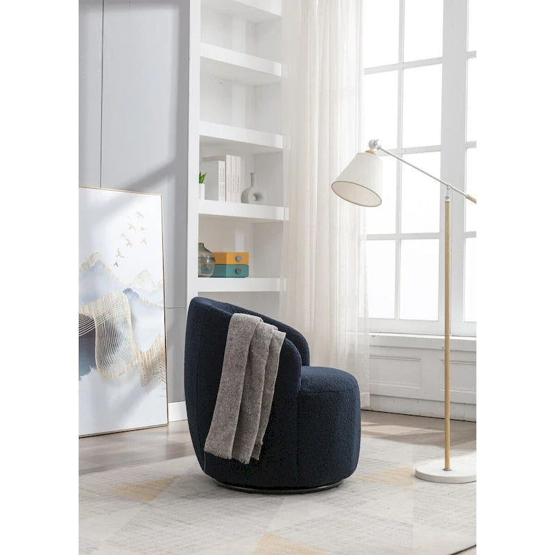 Fauteuil pivotant en velours avec piètement en métal laqué noir.