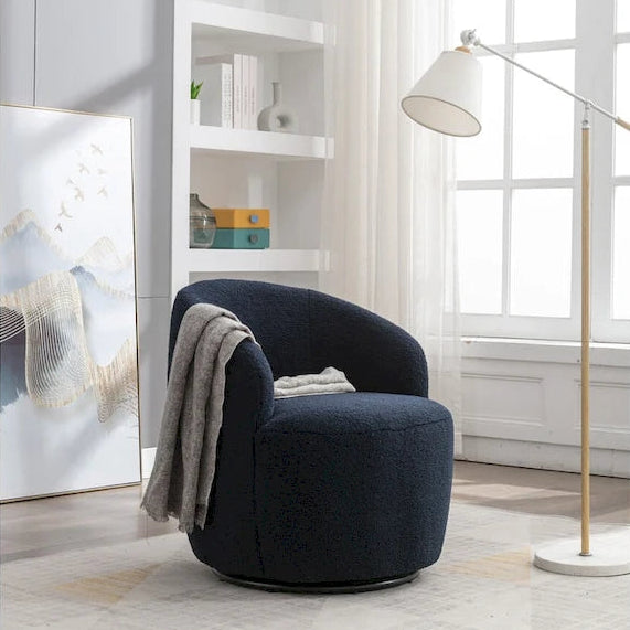 Fauteuil pivotant en velours avec piètement en métal laqué noir.
